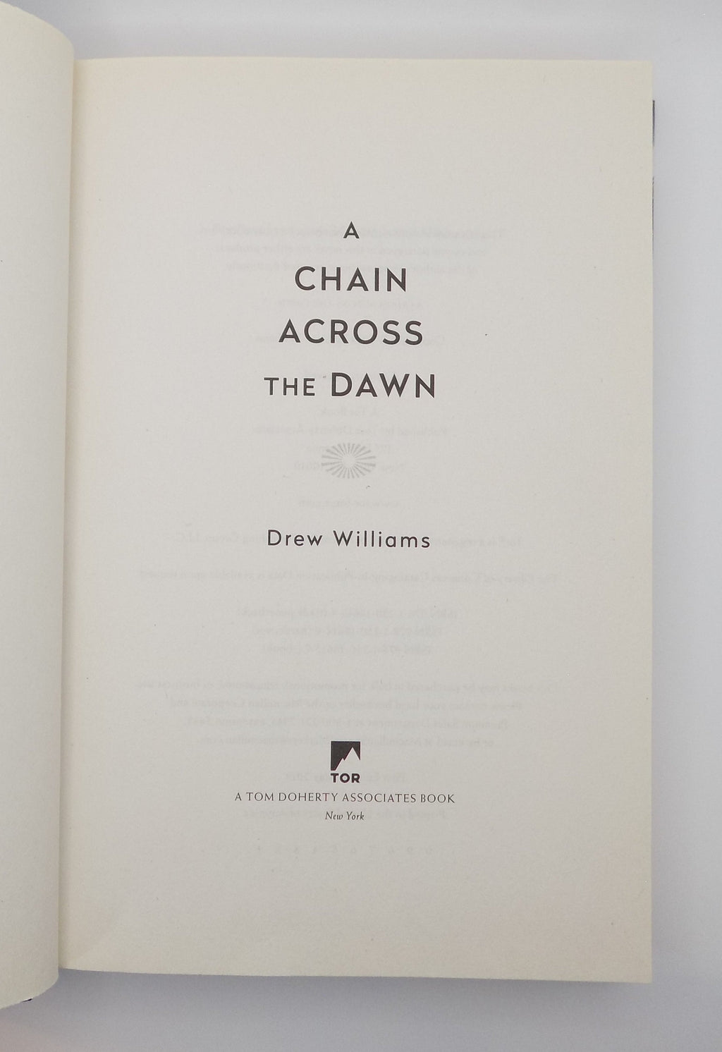 A Chain Across The Dawn by Drew William · Tor, 2019 · First Edition